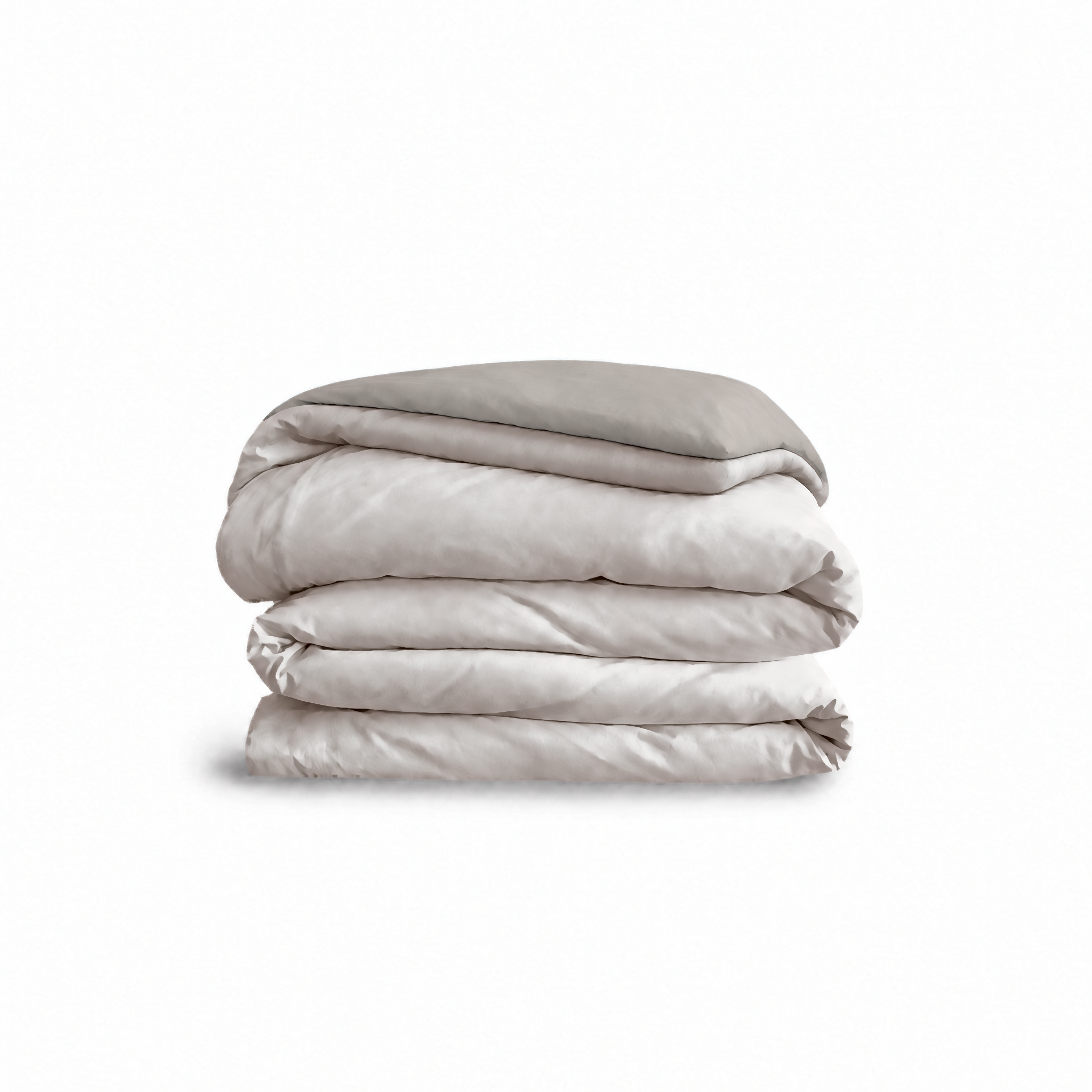 Down for Good Essential duvet cover panels, folded and stacked, in Shell and Fog organic cotton.