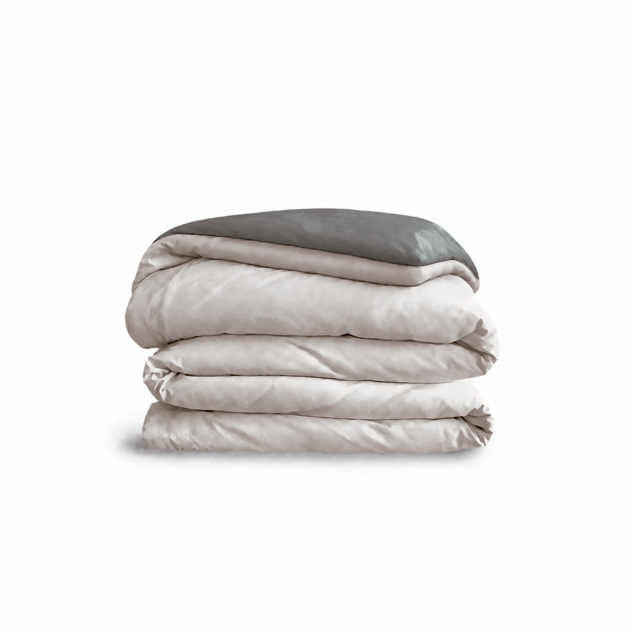 Down for Good Essential duvet cover panels, folded and stacked, in Shell and Riverbed organic cotton.