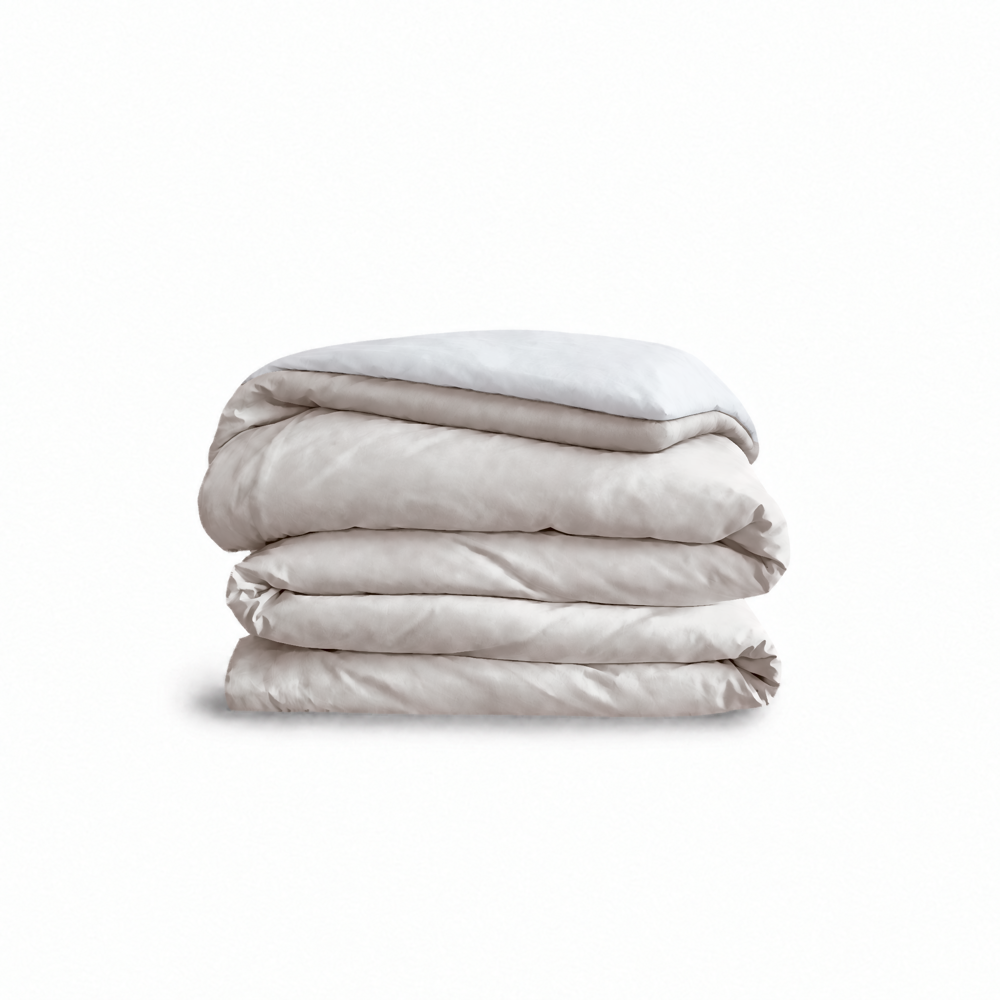 Down for Good Essential duvet cover panels, folded and stacked, in Shell and White organic cotton.