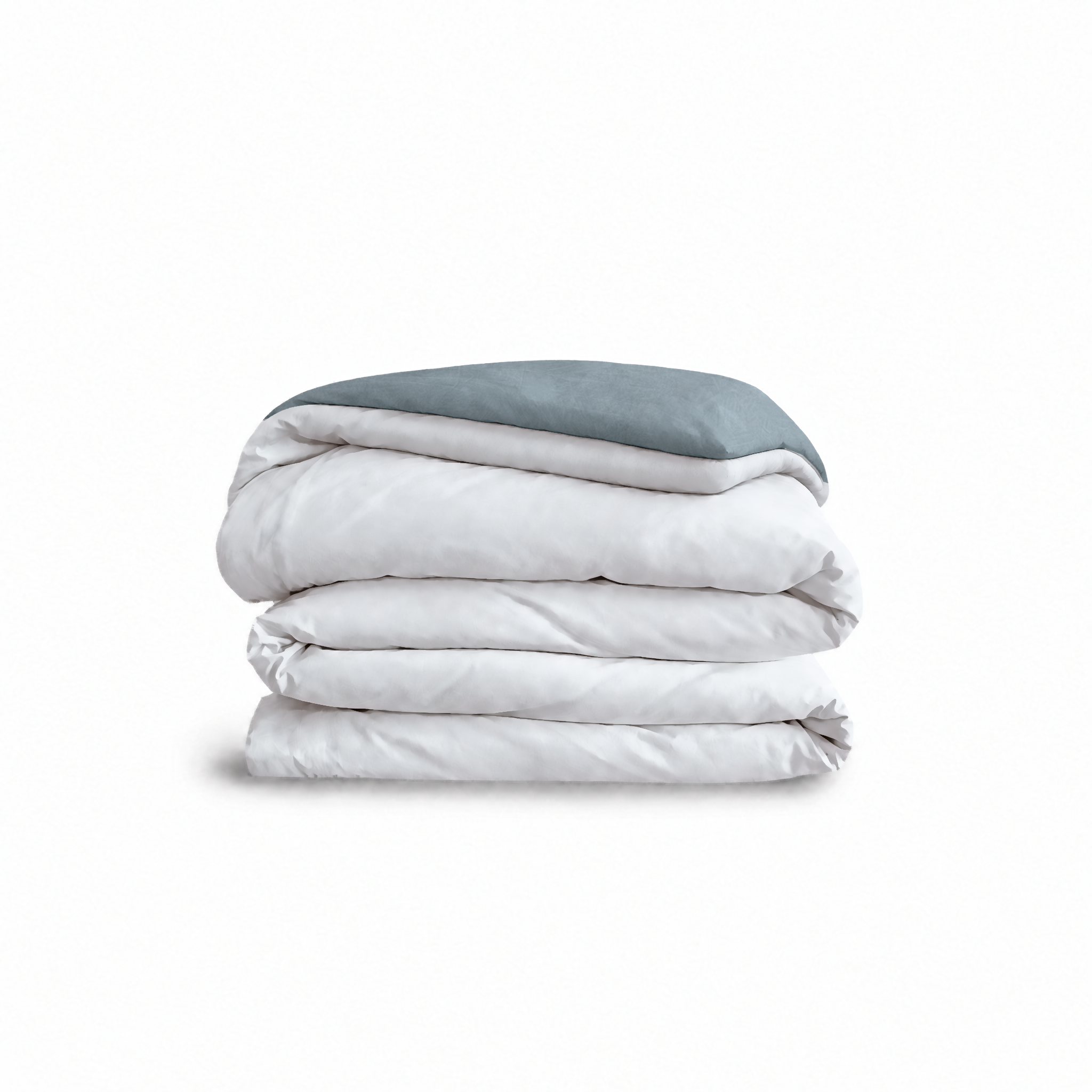 Down for Good Essential duvet cover panels, folded and stacked, in White and Blue Haze organic cotton.
