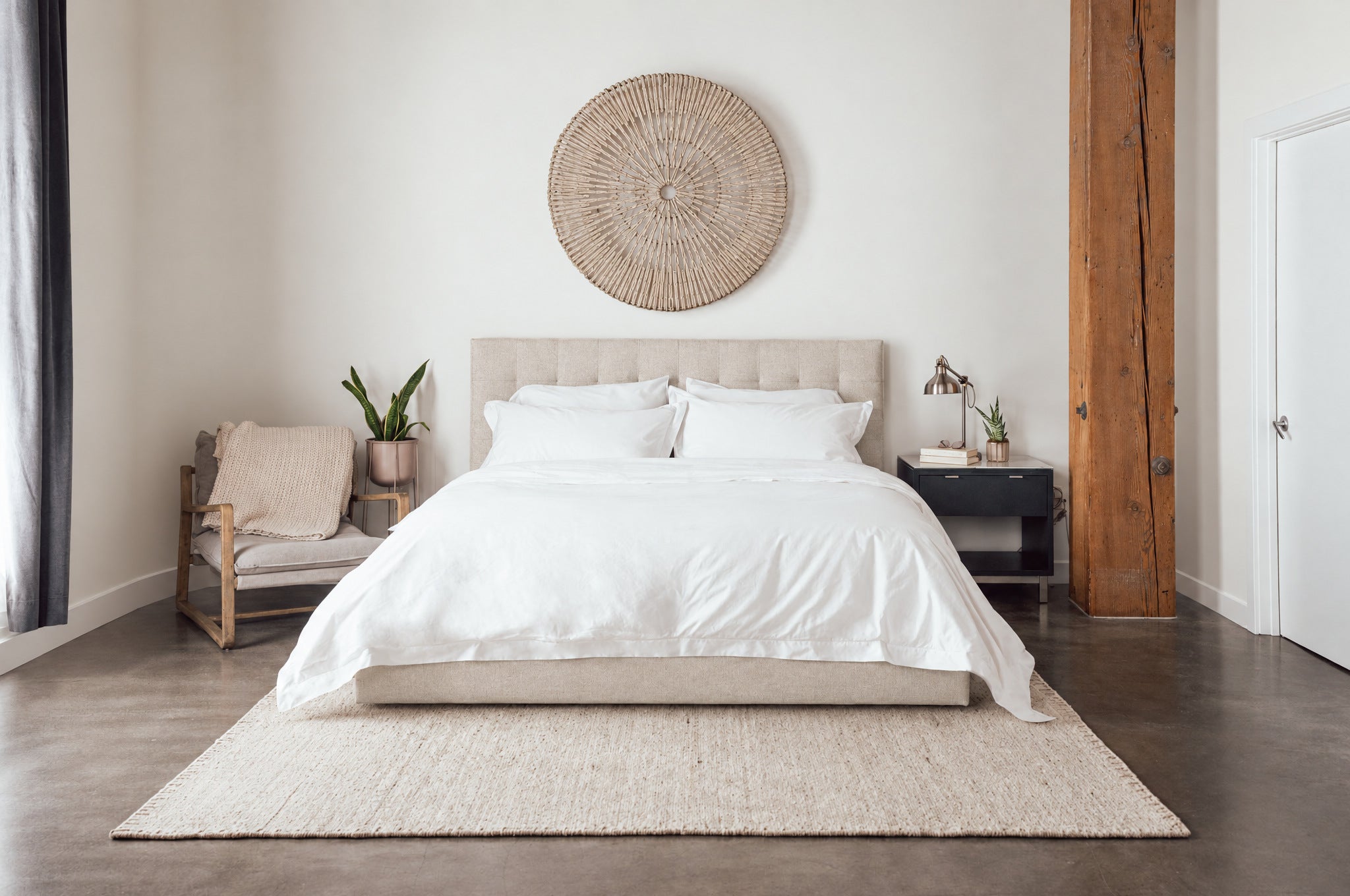 A styled bedroom with the three-piece duvet system made up on the bed