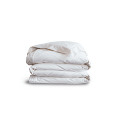 A folded organic white down duvet system on a plain background.